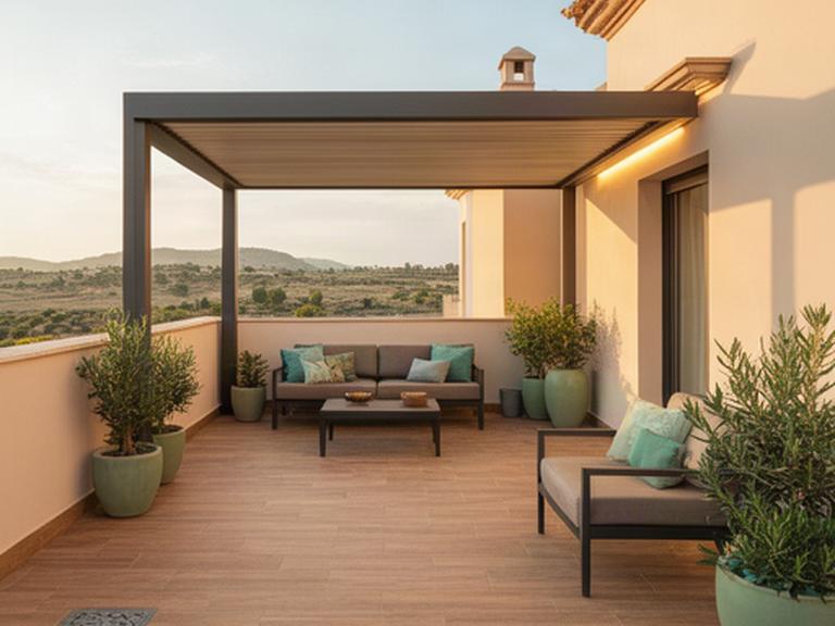 Terraza terminada en Priego de Córdoba con pavimento porcelánico, pérgola y zona de descanso luminosa